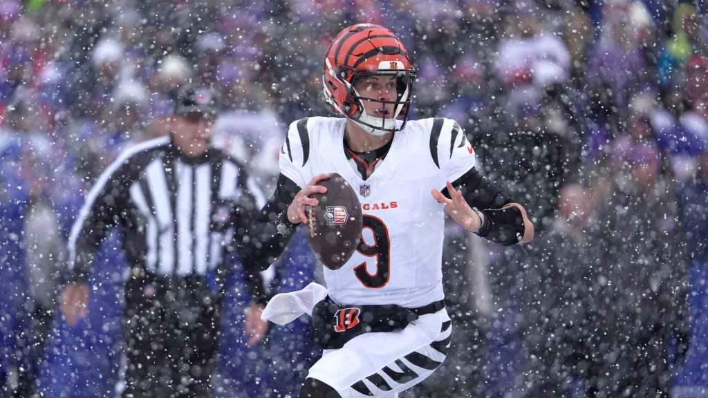 Cincinnati Bengals quarterback Joe Burrow runs to the sideline looking for an open receiver during first half action at Highmark Stadium in Orchard Park on Dec. 7, 2025.