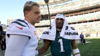Cincinnati Bengals quarterback Joe Burrow (9) and Philadelphia Eagles quarterback Jalen Hurts (1) meet after the game Paycor Stadium.