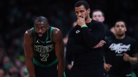Boston Celtics head coach Joe Mazzulla talks with guard Jaylen Brown (7) from the sideline as they take on the Orlando Magic during game five of first round for the 2025 NBA Playoffs at TD Garden.