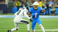Los Angeles Chargers wide receiver Quentin Johnston (1) runs against Philadelphia Eagles cornerback Adoree' Jackson (8) in the first half at SoFi Stadium.