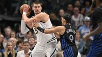 Denver Nuggets center Nikola Jokic (15) looks to move the ball past Dallas Mavericks guard Ryan Nembhard (9) during the second half at the American Airlines Center.