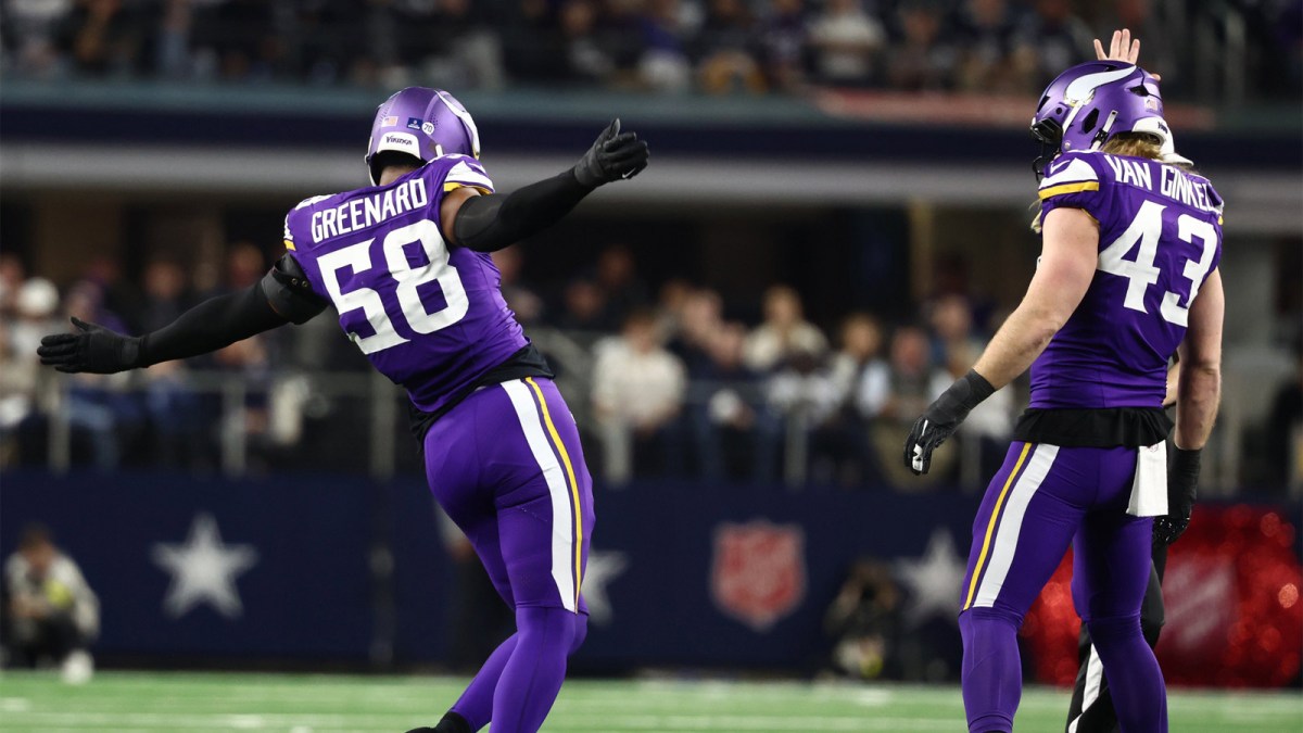 Minnesota Vikings linebacker Jonathan Greenard (58) and Minnesota Vikings linebacker Andrew van Ginkel (43) celebrate after a play during the first half against the Dallas Cowboys at AT&T Stadium.