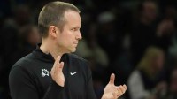 Phoenix Suns head coach Jordan Ott claps for his team as they play the Minnesota Timberwolves in the third quarter at Target Center