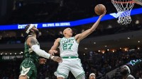 Boston Celtics forward Jordan Walsh (27) takes a shot against Milwaukee Bucks guard Gary Trent Jr. (5) in the third quarter at Fiserv Forum.