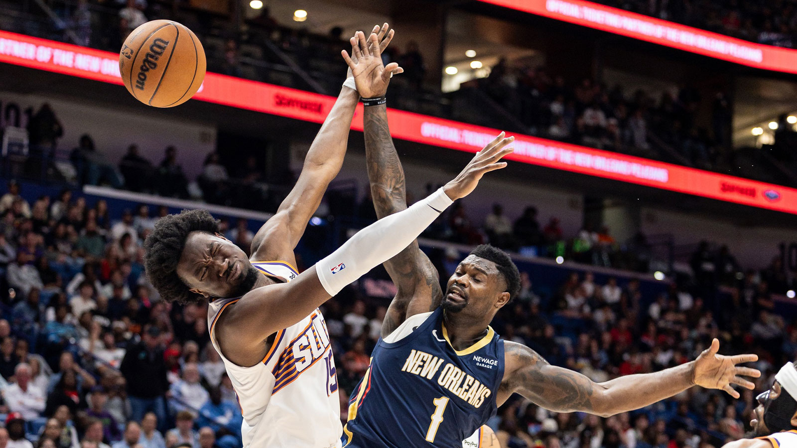 New Orleans Pelicans forward Zion Williamson (1) blocks the shot of Phoenix Suns center Mark Williams (15) during the second half at Smoothie King Center.