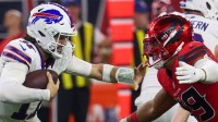 Buffalo Bills quarterback Josh Allen (17) stiff arms Houston Texans linebacker Henry To'oTo'o (39) in the second half at NRG Stadium.