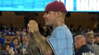 Justin Bieber looks on in Game 3 of World Series between Dodgers, Blue Jays