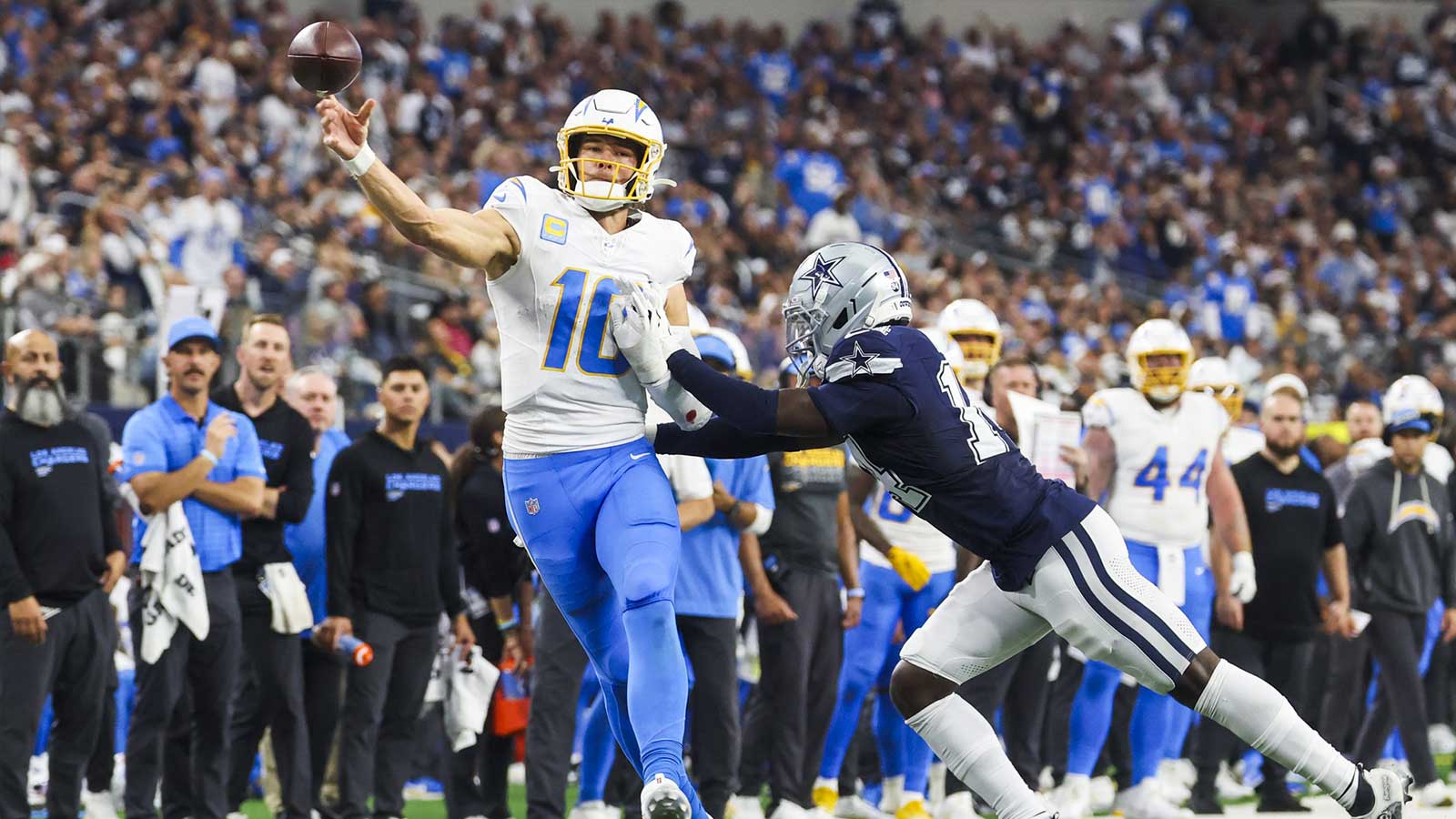 Los Angeles Chargers quarterback Justin Herbert (10) passes against the Dallas Cowboys during the fourth quarter at AT&T Stadium.