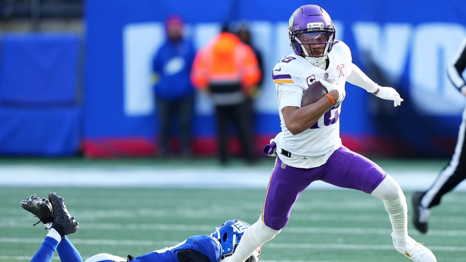 Minnesota Vikings wide receiver Justin Jefferson (18) makes a catch against New York Giants cornerback Paulson Adebo (21) during the first half at MetLife Stadium.