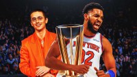 Timothée Chalamet and New York Knicks star Karl-Anthony Towns with NBA Cup trophy.
