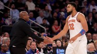 New York Knicks head coach Mike Brown high fives center Karl-Anthony Towns (32) during the fourth quarter against the Cleveland Cavaliers at Madison Square Garden.