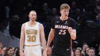 Miami Heat guard Kasparas Jakucionis (25) reacts after a play againstteh Boston Celtics in the first quarter at TD Garden.