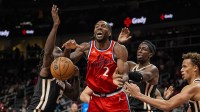 LA Clippers forward Kawhi Leonard (2) fights for a rebound with Atlanta Hawks guard Keaton Wallace (2) and forward Onyeka Okongwu (17) during the second half at State Farm Arena.
