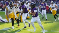 Baltimore Ravens running back Keaton Mitchell (34) runs with the ball against the Pittsburgh Steelers during the first half at M&T Bank Stadium.