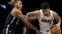 Brooklyn Nets forward Noah Clowney (21) reaches for the ball against Miami Heat center Kel'El Ware (7) during the third quarter at Barclays Center.
