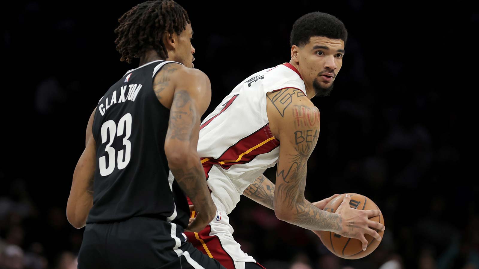 Miami Heat center Kel'El Ware (7) controls the ball against Brooklyn Nets center Nic Claxton (33) during the fourth quarter at Barclays Center.