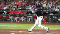 Arizona Diamondbacks second base Ketel Marte (4) hits an RBI single against the Philadelphia Phillies during the third inning at Chase Field.