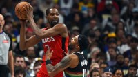 Houston Rockets forward Kevin Durant (7) holds the ball as he is defended by Denver Nuggets guard Bruce Brown (11) during the second half at Ball Arena. Mandatory Credit: Christopher Hanewinckel-Imagn Images