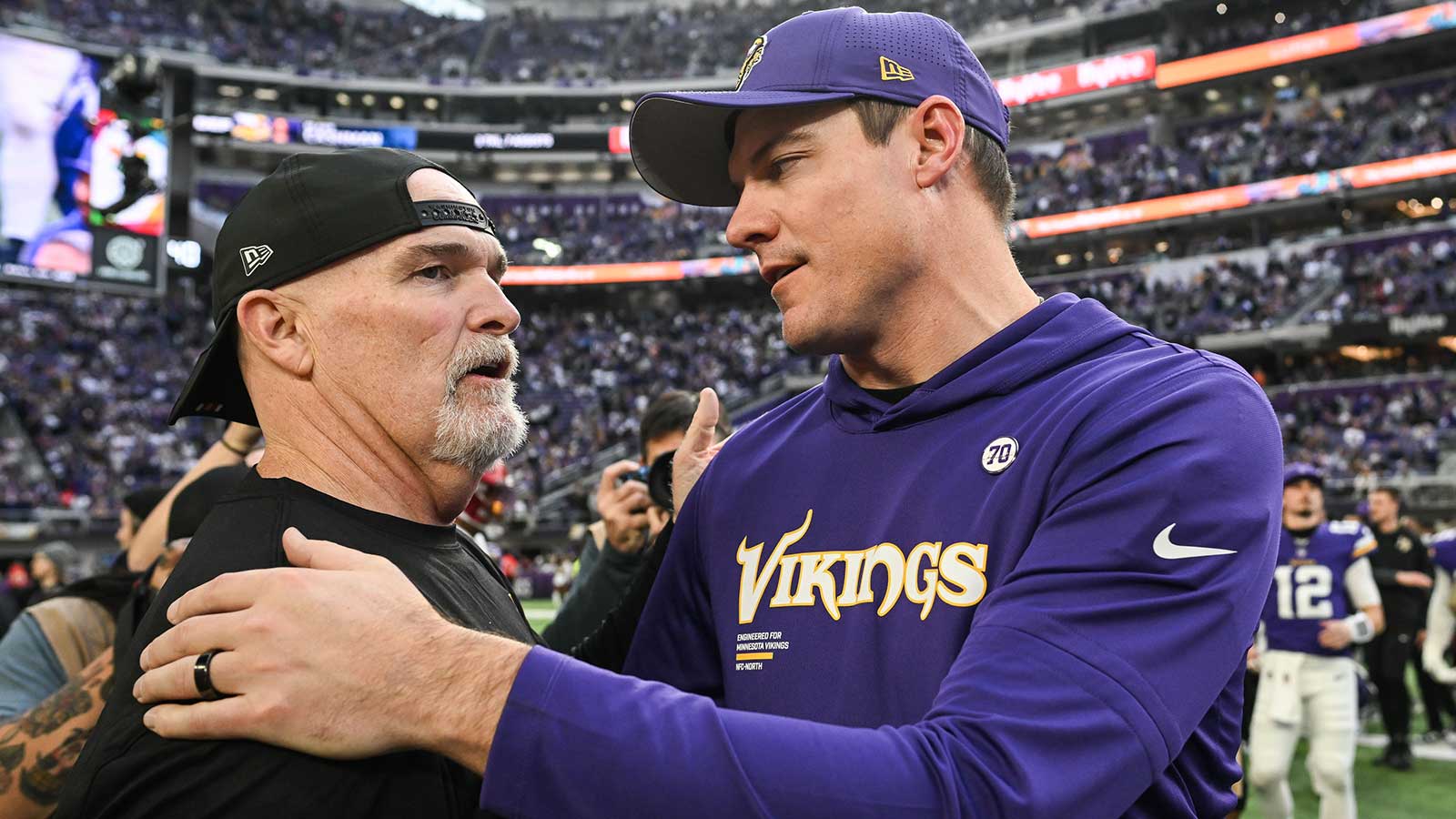 Minnesota Vikings head coach Kevin O'Connell reacts with Washington Commanders head coach Dan Quinn after the game at U.S. Bank Stadium. 