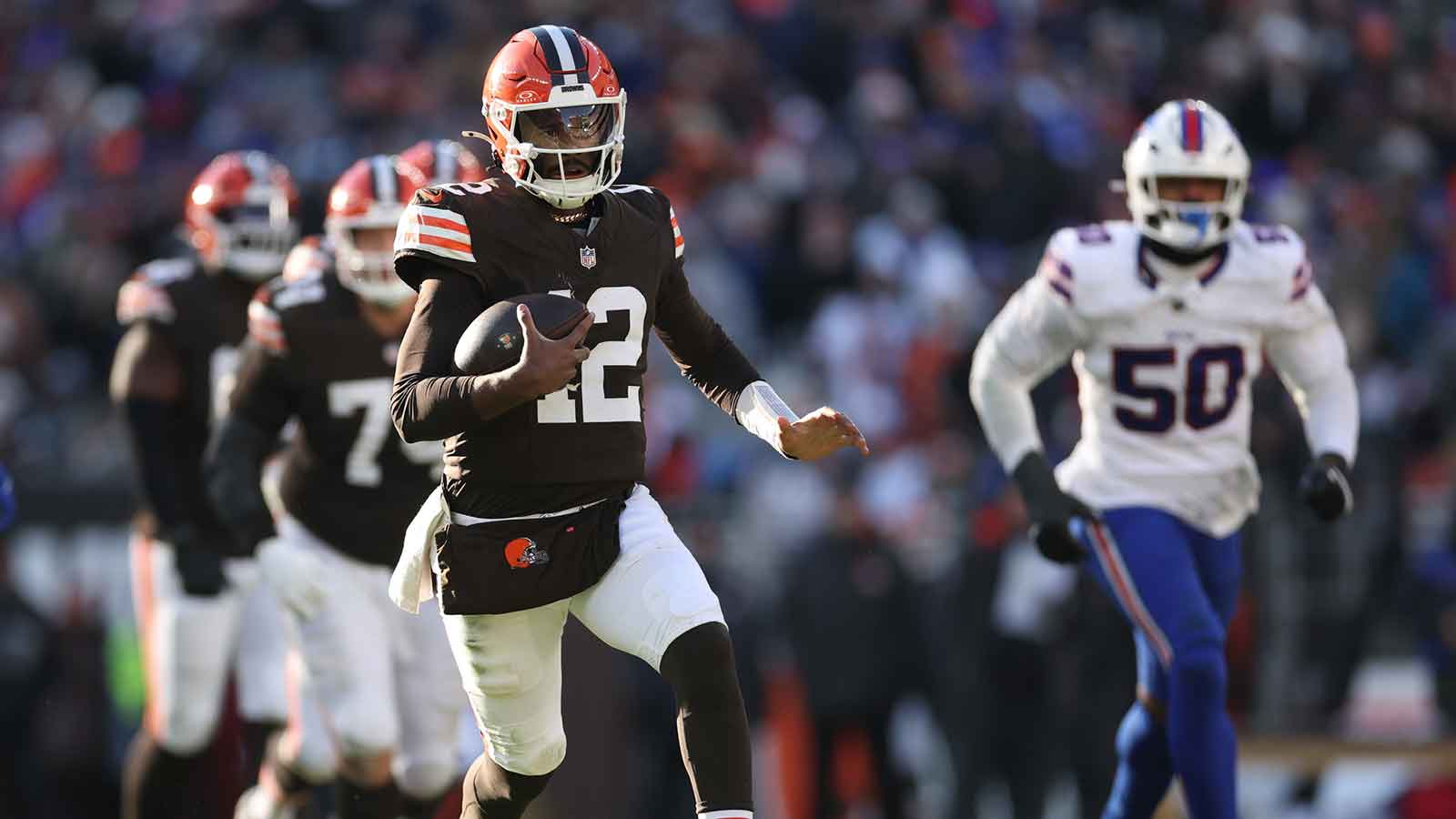 Cleveland Browns quarterback Shedeur Sanders (12) carries the ball against the Buffalo Bills during the second half at Huntington Bank Field.