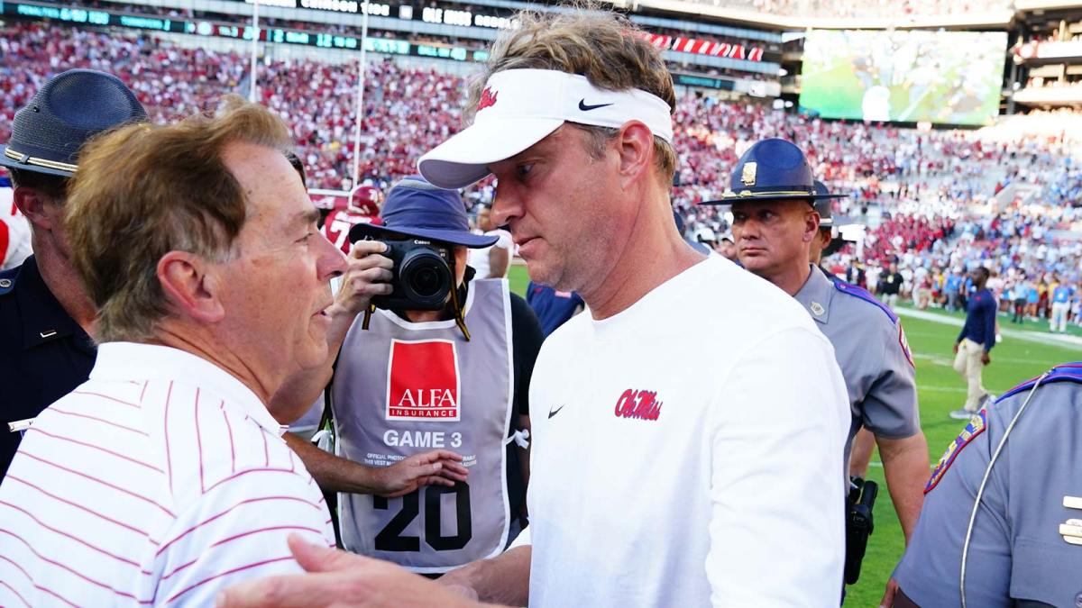Alabama Crimson Tide head coach Nick Saban greets Mississippi Rebels head coach Lane Kiffin midfield after Alabama defeated the Rebels 24-10 at Bryant-Denny Stadium.