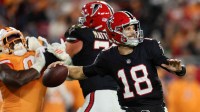 Atlanta Falcons quarterback Kirk Cousins (18) throws a pass and offensive tackle Jake Matthews (70) blocks against Tampa Bay Buccaneers linebacker Yaya Diaby (0) during the second quarter at Raymond James Stadium.