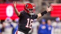 Atlanta Falcons quarterback Kirk Cousins (18) celebrates after a touchdown pass against the Los Angeles Rams in the first quarter at Mercedes-Benz Stadium.