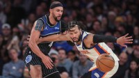 Orlando Magic guard Jalen Suggs (4) knocks the ball away from New York Knicks guard Jalen Brunson (11) in the fourth quarter at Madison Square Garden.