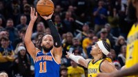 New York Knicks guard Jalen Brunson (11) shoots the winning shot while Indiana Pacers guard/forward Andrew Nembhard (2) defends in the second half at Gainbridge Fieldhouse.