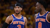 Knicks guard Josh Hart (3) and forward OG Anunoby (8) speak in the third quarter during game six of the eastern conference finals against the Indiana Pacers for the 2025 NBA Playoffs at Gainbridge Fieldhouse with the Pacers logo in the background with Knicks injury report in the background