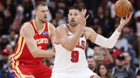 Atlanta Hawks center Kristaps Porzingis (8) defends against Chicago Bulls center Nikola Vucevic (9) during the second half at United Center.