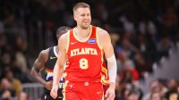 Atlanta Hawks center Kristaps Porzingis (8) reacts after a basket against the Denver Nuggets in the third quarter at State Farm Arena.