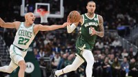 Boston Celtics forward Jordan Walsh (27) tries to steal the ball from Milwaukee Bucks forward Kyle Kuzma (18) in the second quarter at Fiserv Forum.