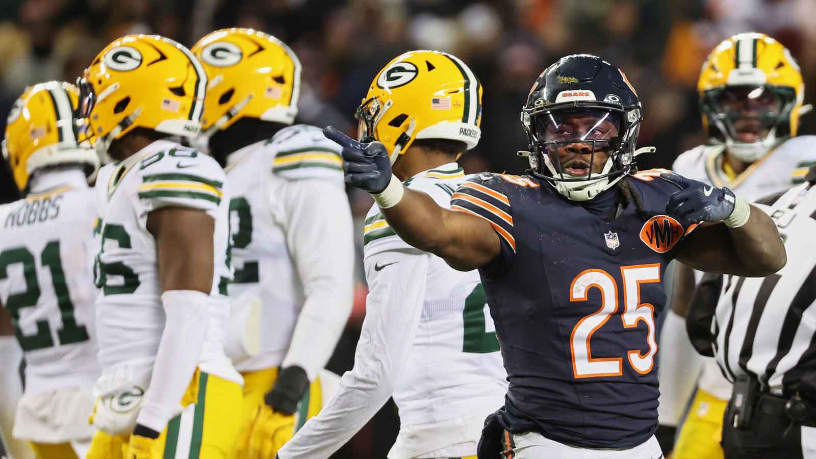 Chicago Bears running back Kyle Monangai (25) gestures toward the Green Bay Packers end zone after running for a first down during overtime at Soldier Field.