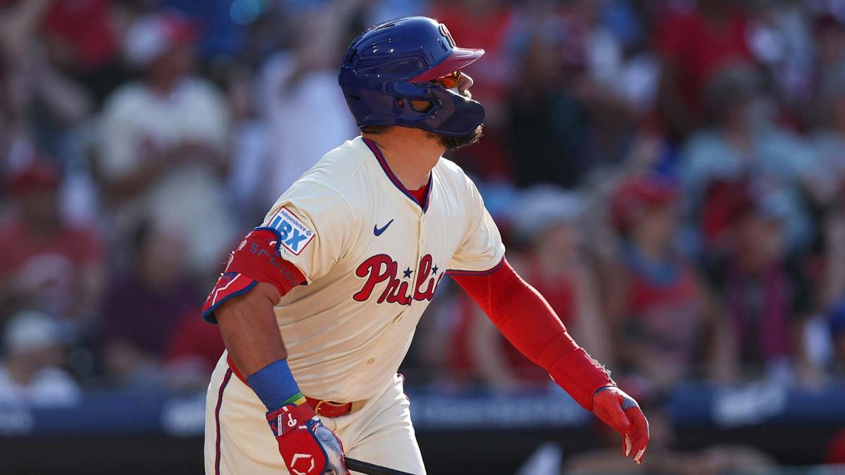 Philadelphia Phillies outfielder Kyle Schwarber (12) hits a two RBI home run during the eighth inning against the Cincinnati Reds at Citizens Bank Park.