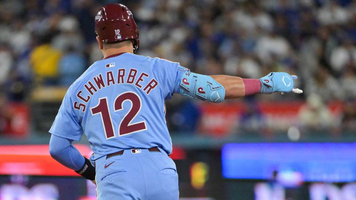 Philadelphia Phillies designated hitter Kyle Schwarber (12) celebrates after hitting a two run home run during the eighth inning against the Los Angeles Dodgers during game three of the NLDS round for the 2025 MLB playoffs at Dodger Stadium.