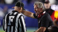 Utah Utes head coach Kyle Whittingham (right) argues a call with field judge Matt Mills during the second half of a game against the Utah Utes at LaVell Edwards Stadium. Mandatory Credit: Rob Gray-Imagn Images