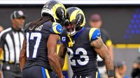 Los Angeles Rams wide receiver Davante Adams (17) celebrates with running back Kyren Williams (23) after scoring a touchdown during the first half against the Seattle Seahawks at SoFi Stadium.