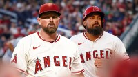 Kirby Yates in a Los Angeles Angels jersey next to Angels Anthony Rendon.