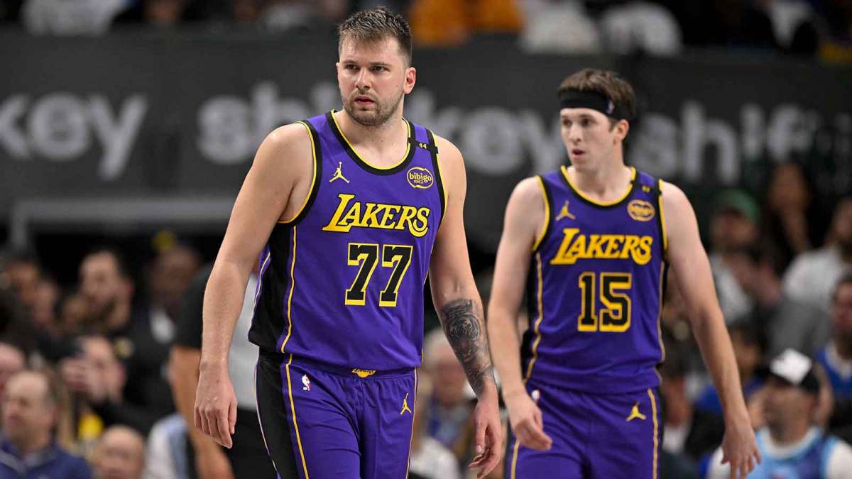Los Angeles Lakers guard Luka Doncic (77) and guard Austin Reaves (15) during the game between the Dallas Mavericks and the Los Angeles Lakers at American Airlines Center.