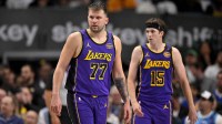 Los Angeles Lakers guard Luka Doncic (77) and guard Austin Reaves (15) during the game between the Dallas Mavericks and the Los Angeles Lakers at American Airlines Center.