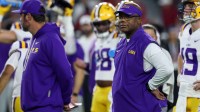 Louisiana State Tigers interim head coach Frank Wilson looks on during warmups prior to the game against the Alabama Crimson Tide at Saban Field at Bryant-Denny Stadium.