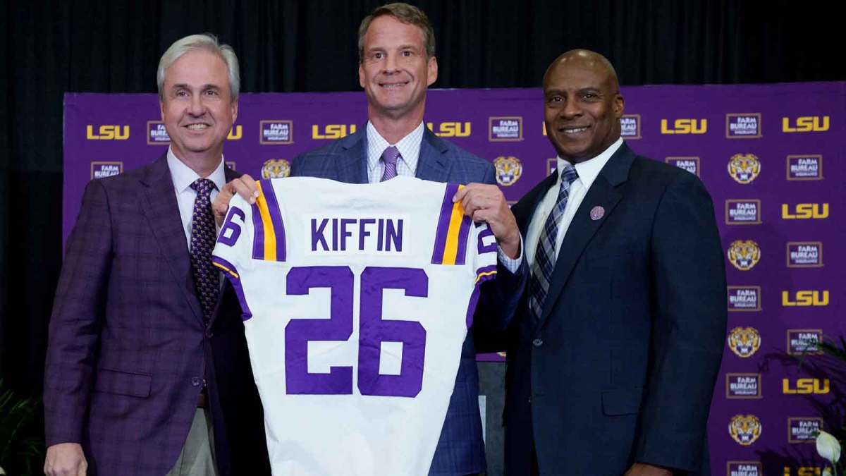 LSU president Wade Rousse, left, LSU new head coach Lane Kiffin and LSU athletic director Verge Ausberry stand together at South Stadium Club at Tiger Stadium.