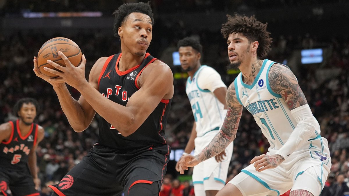 Toronto Raptors guard Scottie Barnes (4) looks for a play as Charlotte Hornets guard LaMelo Ball (1) defends during the first half at Scotiabank Arena.