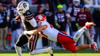 South Carolina Gamecocks quarterback Lanorris Sellers (16) is brought down by Clemson Tigers linebacker Sammy Brown (47) in the second quarter at Williams-Brice Stadium.