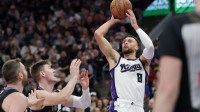 Sacramento Kings guard Zach LaVine (8) shoots the ball past Utah Jazz forward Kyle Filipowski (22) during the second quarter at Delta Center.