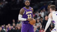 Los Angeles Lakers forward Lebron James (23) holds the ball during the second quarter against the Utah Jazz at Delta Center.