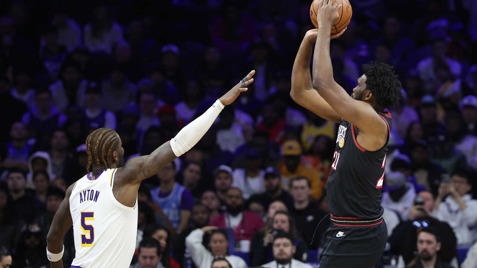76ers center Joel Embiid (21) shoots against Los Angeles Lakers center Deandre Ayton (5) during the fourth quarter at Xfinity Mobile Arena