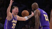 Lakers guard Luka Doncic (77) and forward Lebron James (23) react after a foul call during the second half against the San Antonio Spurs at Crypto.com Arena