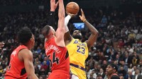 Los Angeles Lakers forward LeBron James (23) shoots the ball as Toronto Raptors center Sandro Mamukelashvili (54) defends in the first half at Scotiabank Arena. Mandatory Credit: Dan Hamilton-Imagn Images